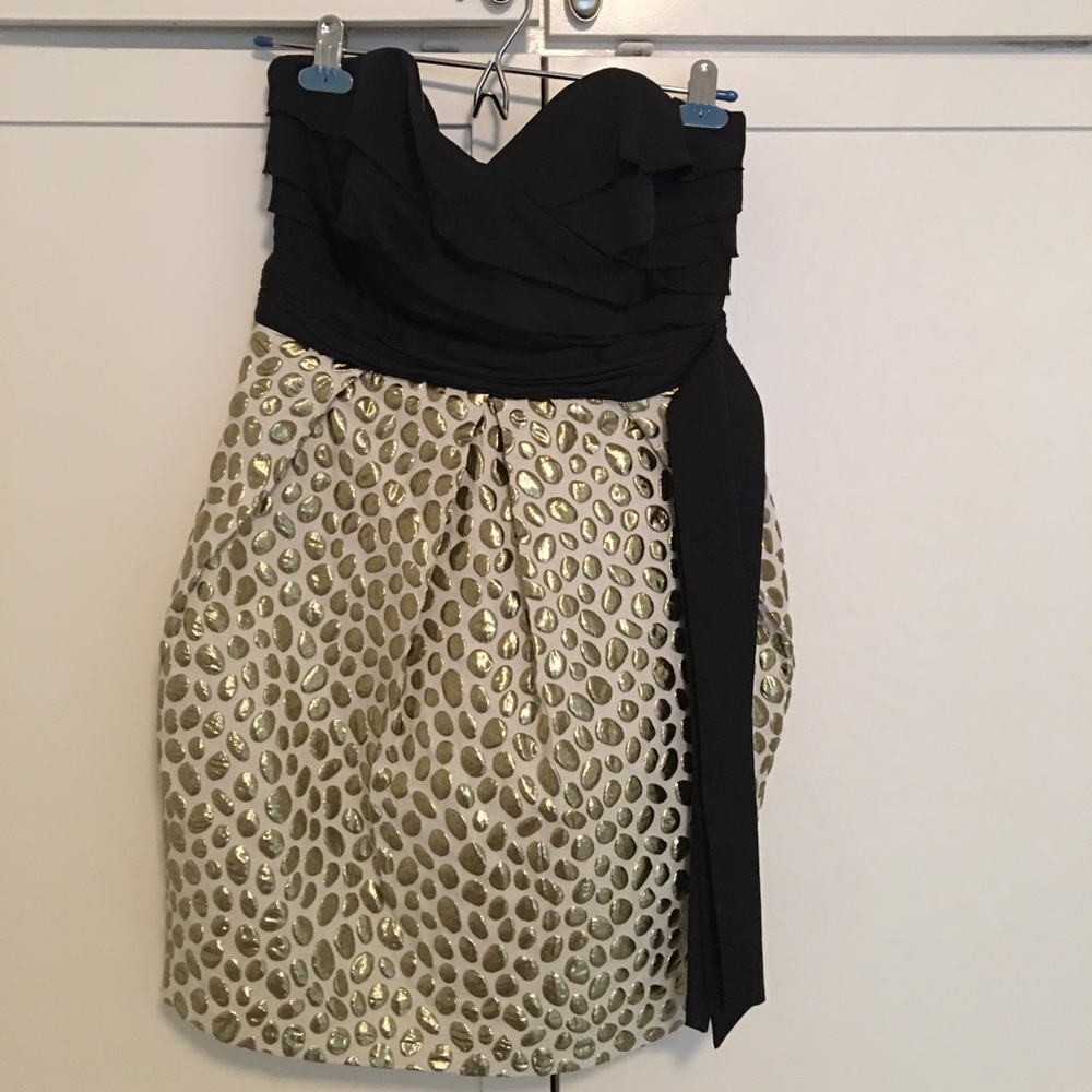 Black, white, and gold cocktail dress